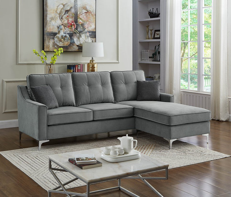 Grey Reversible Sectional Features button tufting and chrome legs