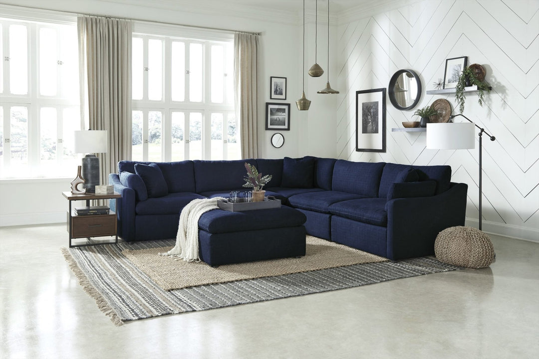 Navy modular sectional w Loose back cushions Payless Furniture